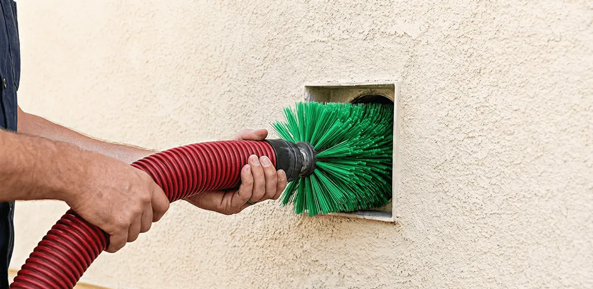 Air duct cleaning brush removing debris from a vent opening in South Bend, IN